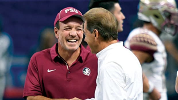 Florida State Seminoles head coach Jimbo Fisher (facing camera) shakes hands with Alabama Crimson Tide head coach Nick Saban before their game at Mercedes-Benz Stadium.